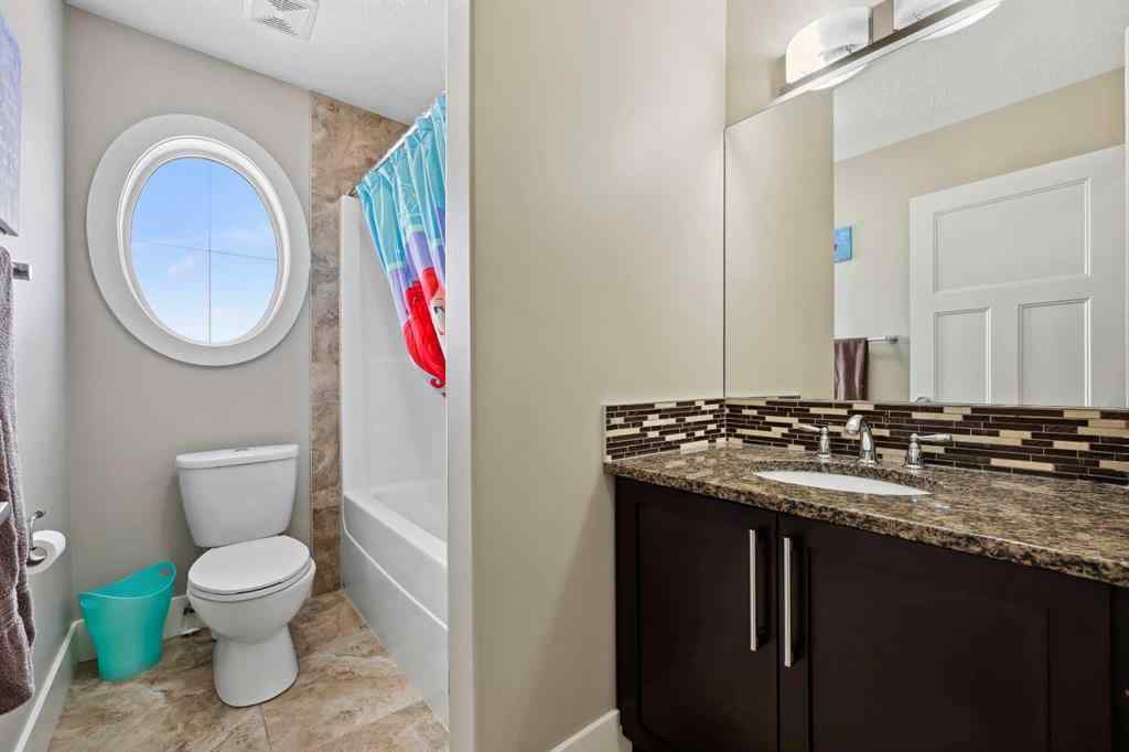 MLS® A2243313 - 913 Canoe Green SW in Canals Airdrie, Residential