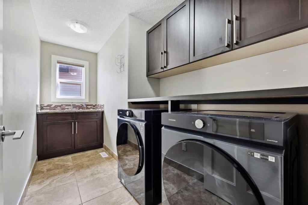 MLS® A2243313 - 913 Canoe Green SW in Canals Airdrie, Residential