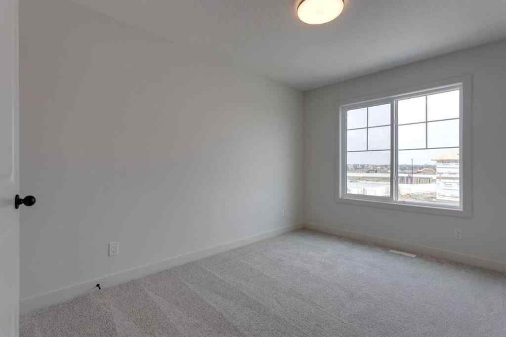 MLS® A2243336 - 21 Bayview Mews SW in Bayview Airdrie, Residential
