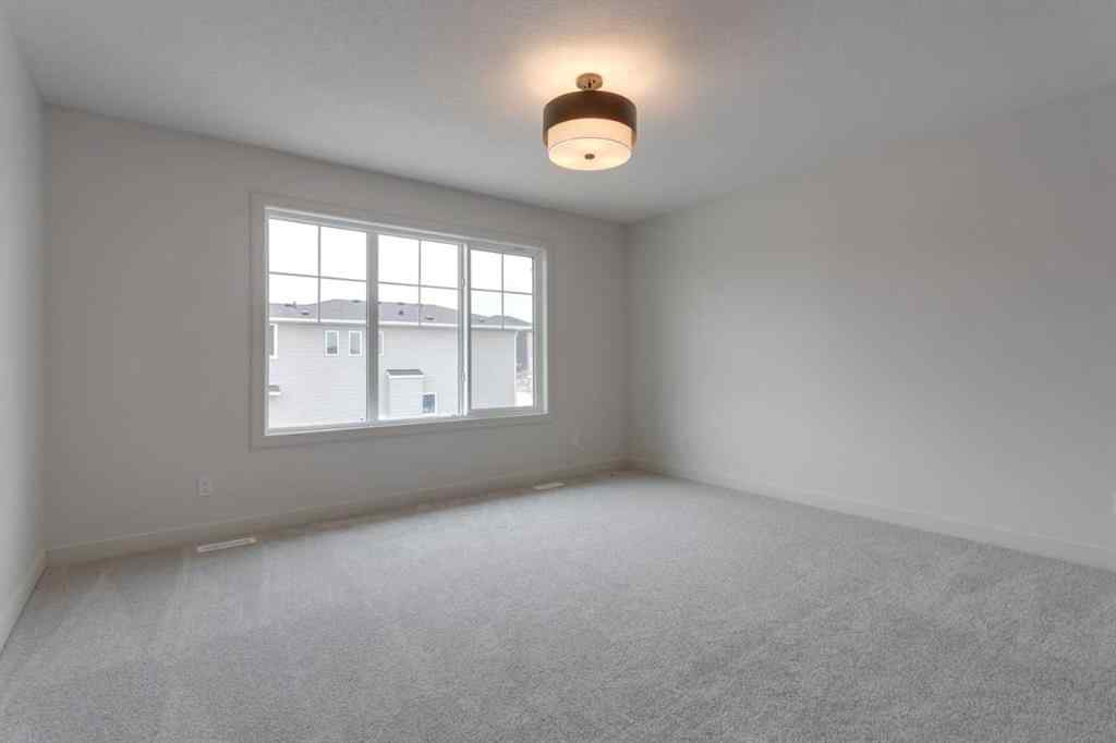 MLS® A2243336 - 21 Bayview Mews SW in Bayview Airdrie, Residential