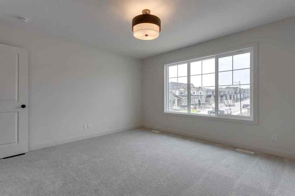 MLS® A2243336 - 21 Bayview Mews SW in Bayview Airdrie, Residential