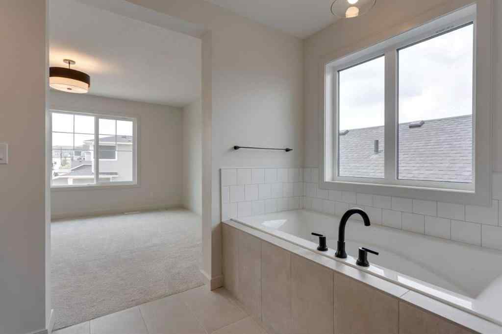 MLS® A2243336 - 21 Bayview Mews SW in Bayview Airdrie, Residential