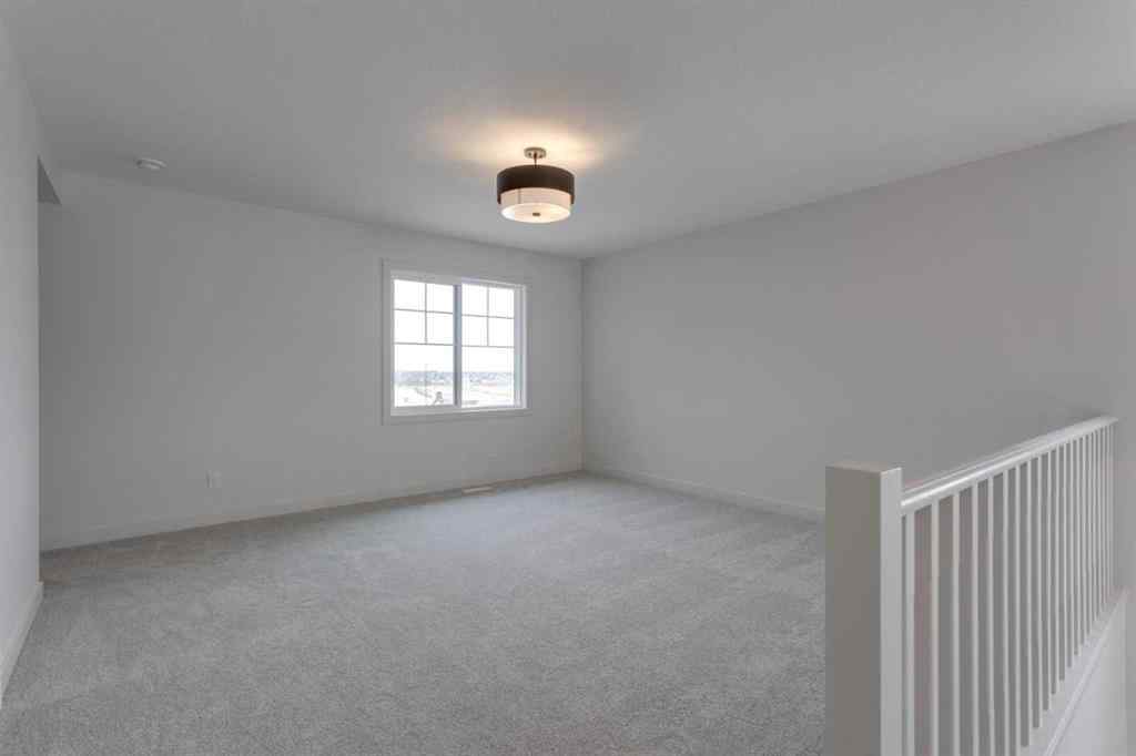 MLS® A2243336 - 21 Bayview Mews SW in Bayview Airdrie, Residential