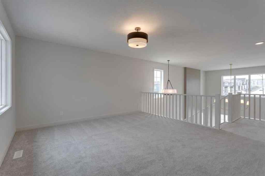 MLS® A2243336 - 21 Bayview Mews SW in Bayview Airdrie, Residential