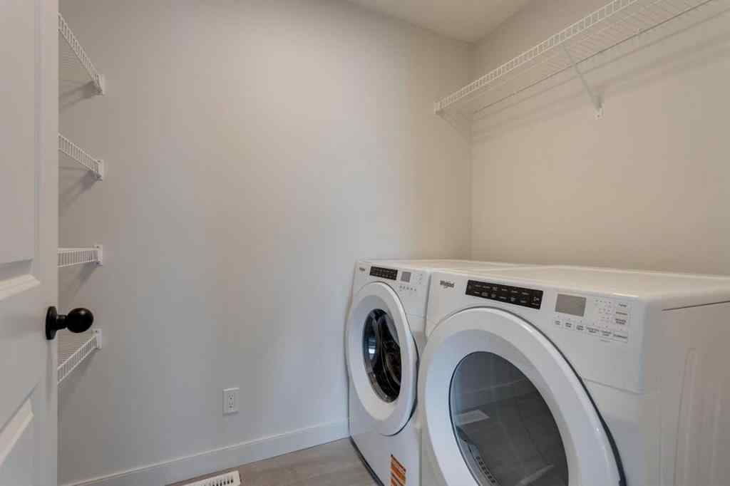 MLS® A2243336 - 21 Bayview Mews SW in Bayview Airdrie, Residential