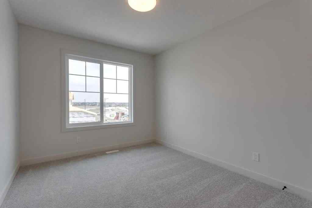 MLS® A2243336 - 21 Bayview Mews SW in Bayview Airdrie, Residential