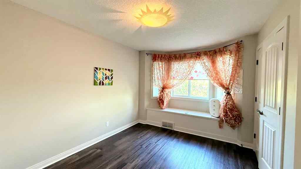 MLS® A2243518 - 8101 9 Avenue SW in West Springs Calgary, Residential