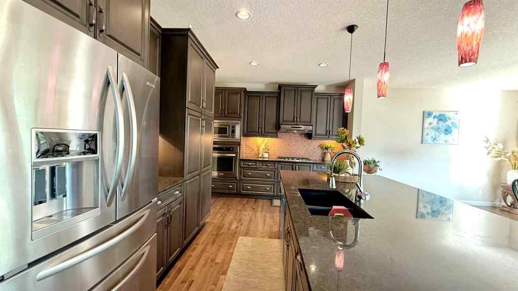 MLS® A2243518 - 8101 9 Avenue SW in West Springs Calgary, Residential