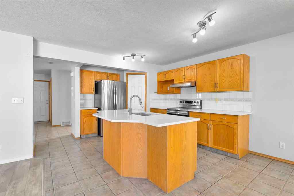 MLS® A2243647 - 35 Saddlehorn Crescent NE in Saddle Ridge Calgary, Residential