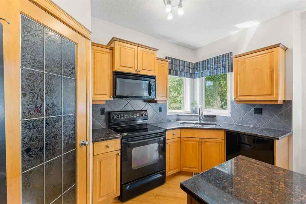 MLS® A2244053 - 11 Simcoe Crescent SW in Signal Hill Calgary, Residential