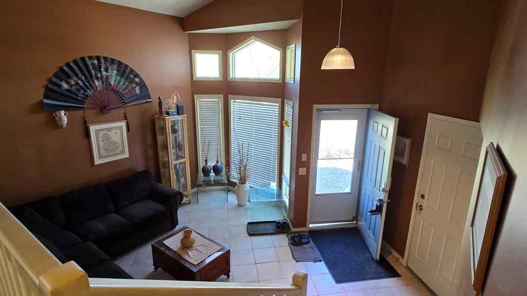 MLS® A2244645 - 203 Arbour Summit Close NW in Arbour Lake Calgary, Residential