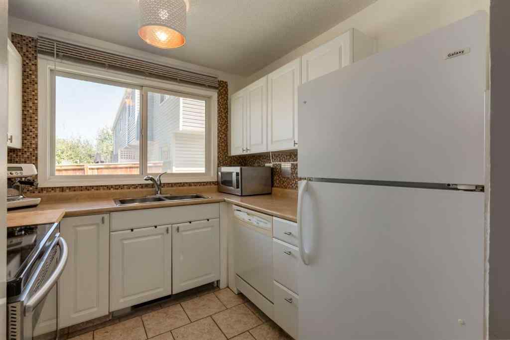 MLS® A2244651 - Unit #21 5425 Pensacola Crescent SE in Penbrooke Meadows Calgary, Residential