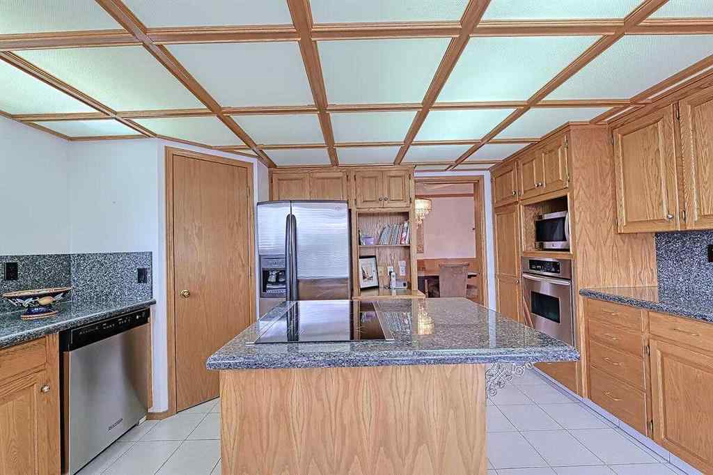 MLS® A2244657 - 115 Strathaven Circle SW in Strathcona Park Calgary, Residential