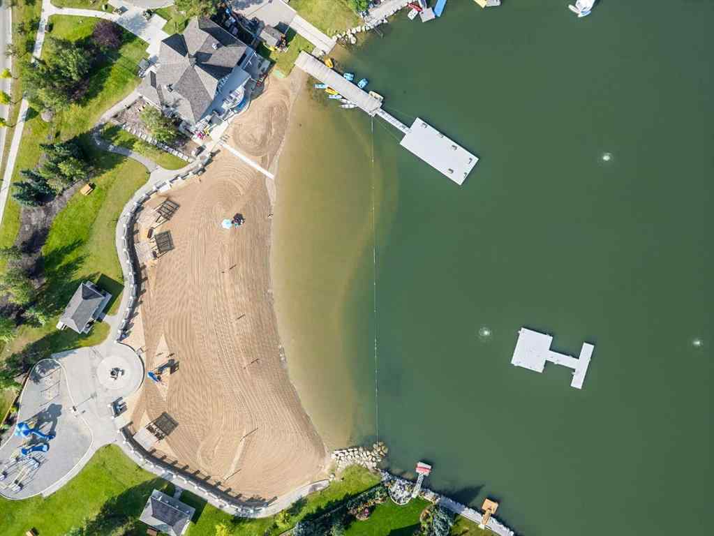 MLS® A2244699 - 95 Crystal Shores Road  in Crystal Shores Okotoks, Residential