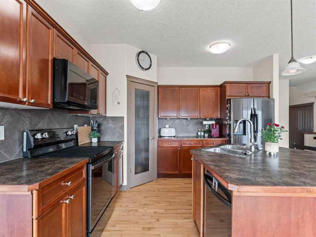 MLS® A2244699 - 95 Crystal Shores Road  in Crystal Shores Okotoks, Residential