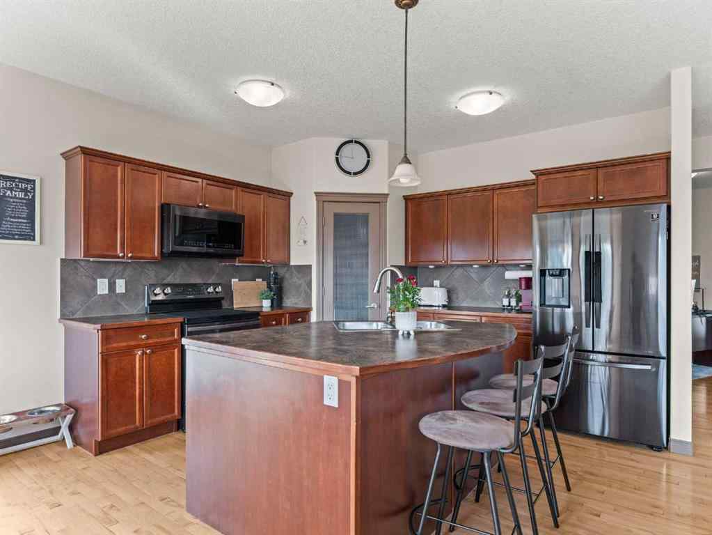 MLS® A2244699 - 95 Crystal Shores Road  in Crystal Shores Okotoks, Residential