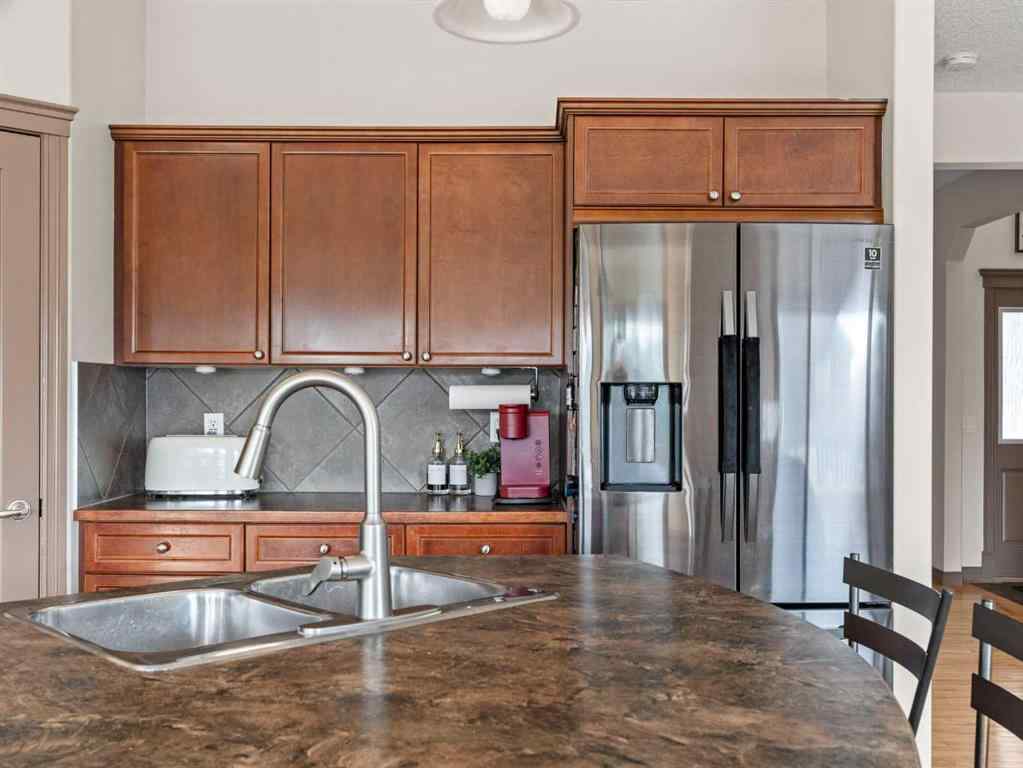MLS® A2244699 - 95 Crystal Shores Road  in Crystal Shores Okotoks, Residential