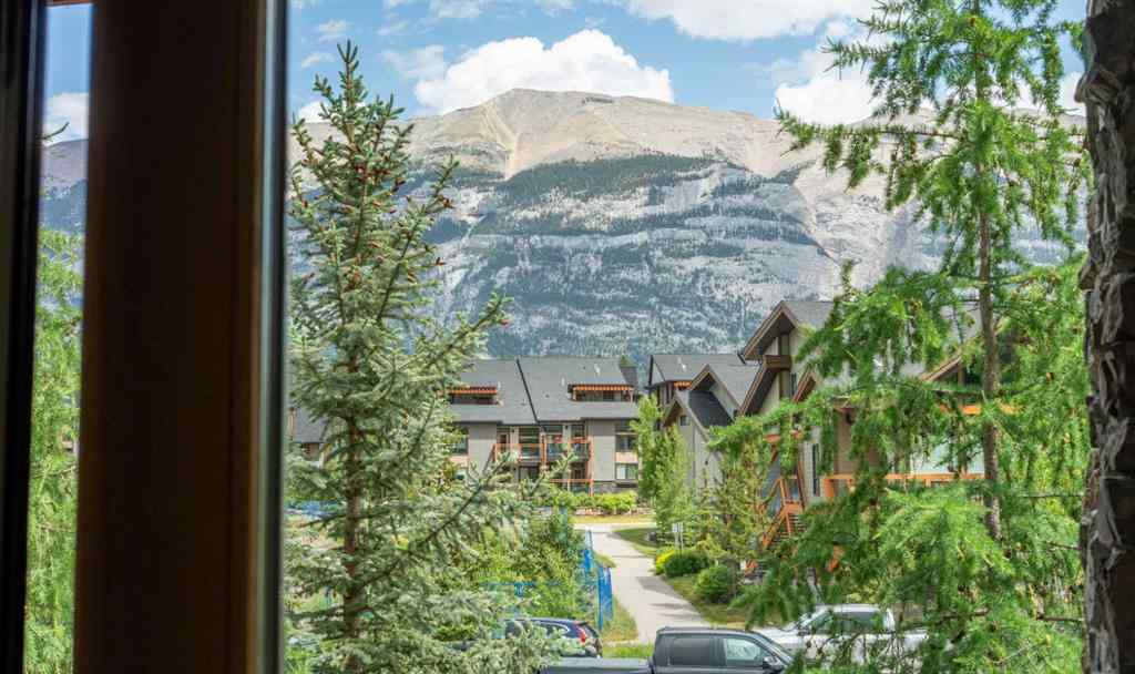 MLS® A2244914 - Unit #205 106 Stewart Creek Landing  in Three Sisters Canmore, Residential