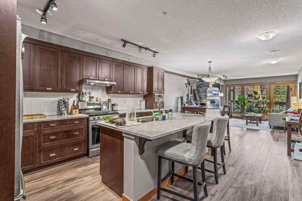 MLS® A2244914 - Unit #205 106 Stewart Creek Landing  in Three Sisters Canmore, Residential