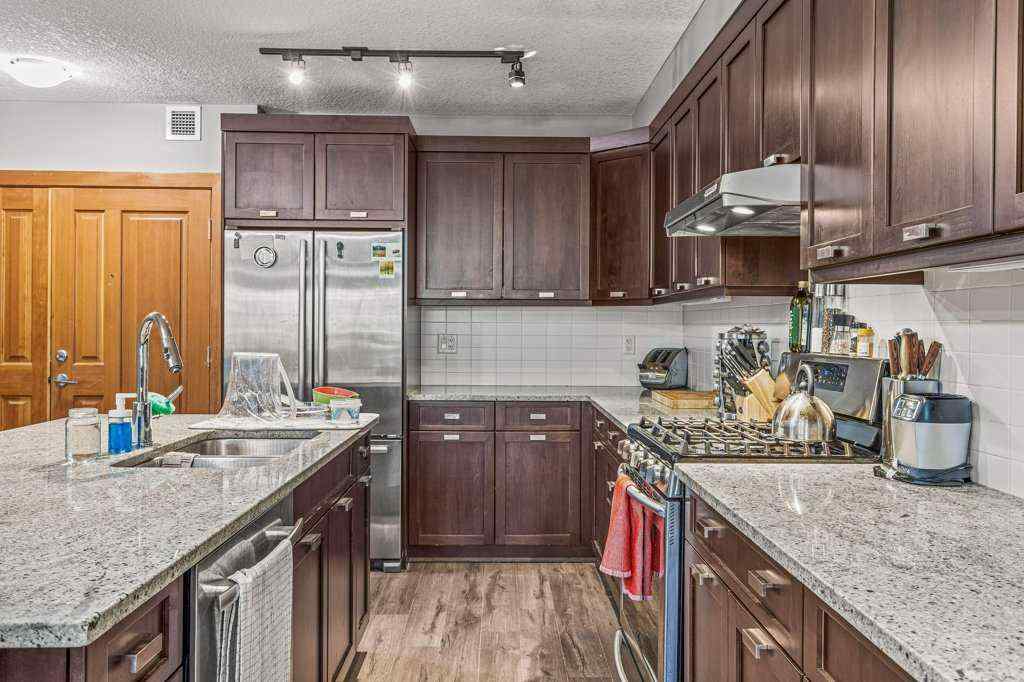 MLS® A2244914 - Unit #205 106 Stewart Creek Landing  in Three Sisters Canmore, Residential