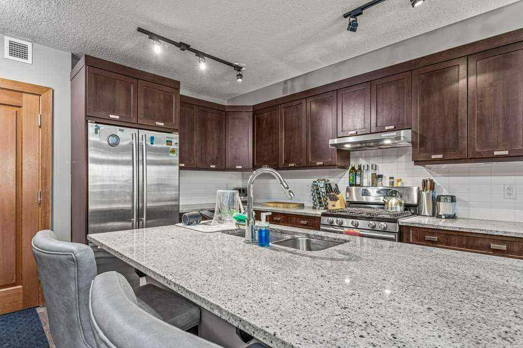 MLS® A2244914 - Unit #205 106 Stewart Creek Landing  in Three Sisters Canmore, Residential