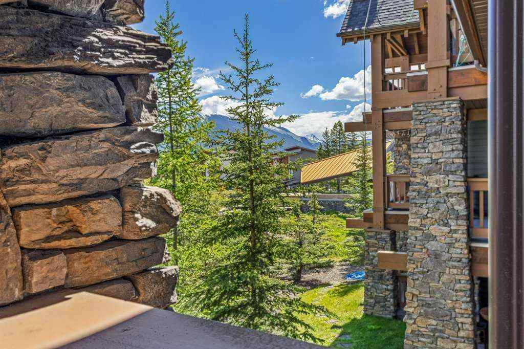 MLS® A2244914 - Unit #205 106 Stewart Creek Landing  in Three Sisters Canmore, Residential