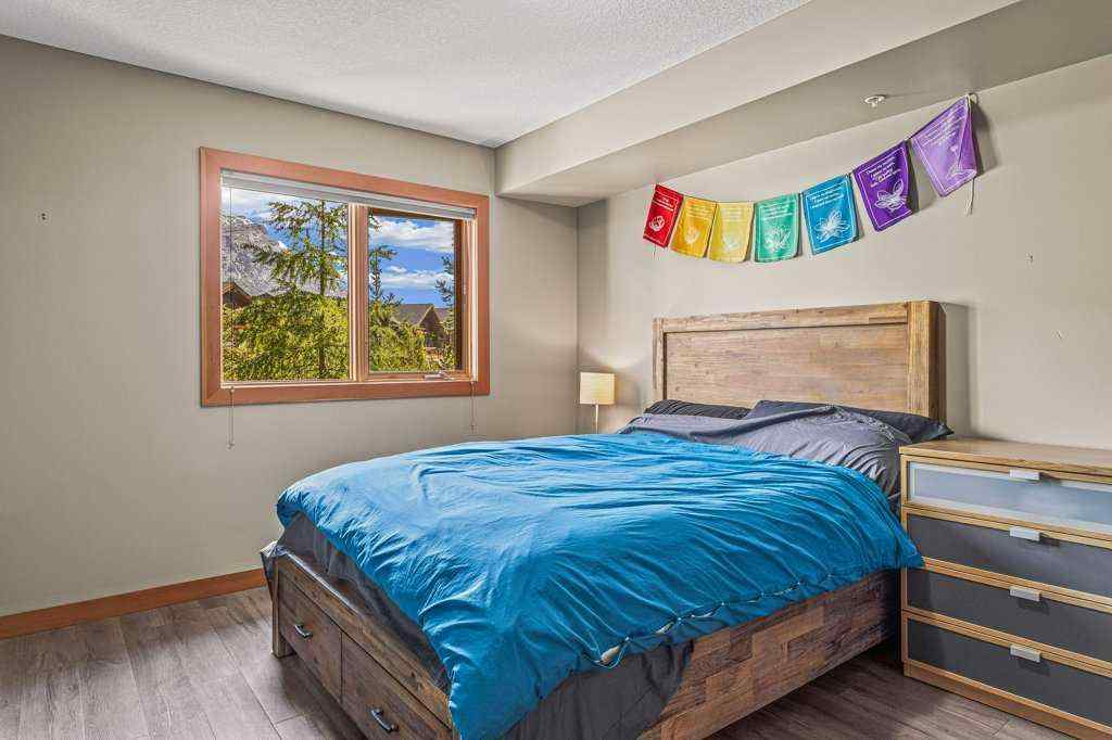 MLS® A2244914 - Unit #205 106 Stewart Creek Landing  in Three Sisters Canmore, Residential