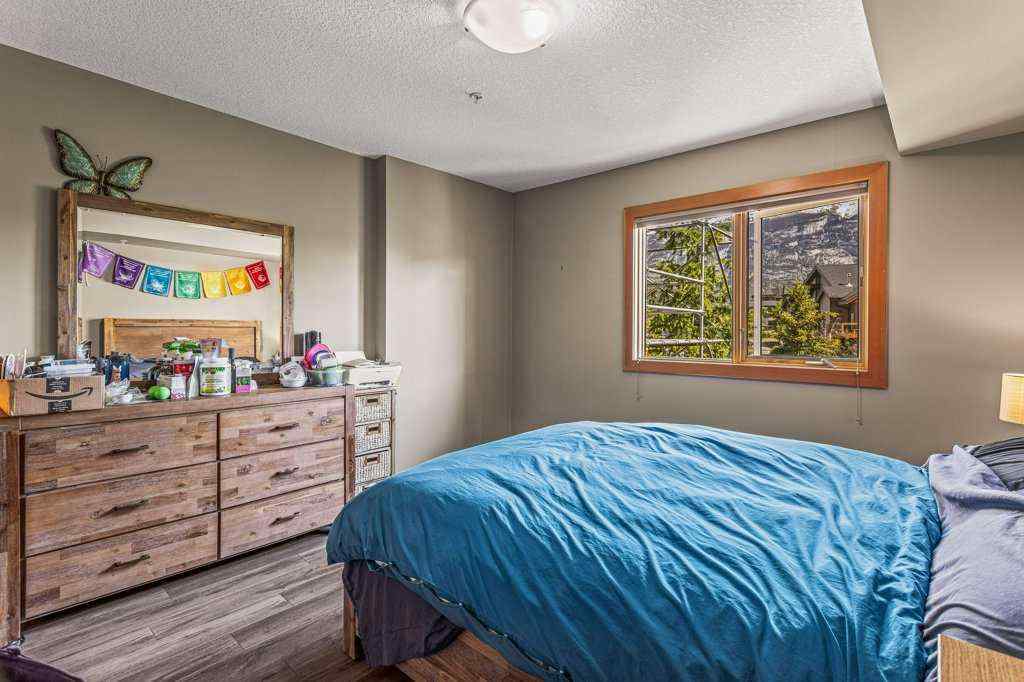 MLS® A2244914 - Unit #205 106 Stewart Creek Landing  in Three Sisters Canmore, Residential