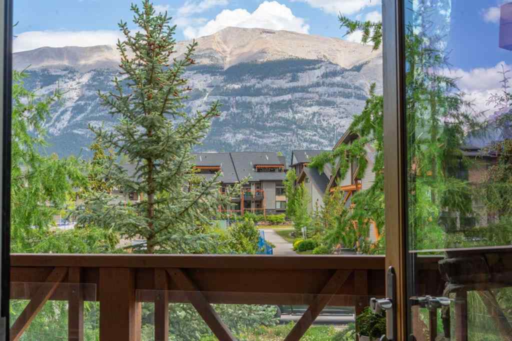 MLS® A2244914 - Unit #205 106 Stewart Creek Landing  in Three Sisters Canmore, Residential