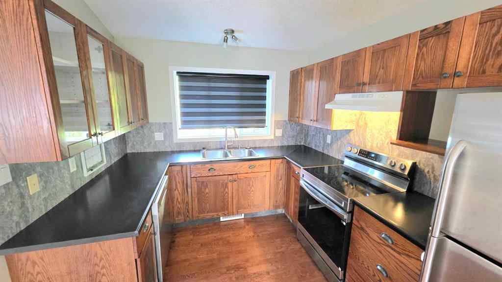 MLS® A2244966 - 9857 66 Avenue  in Country Club West Grande Prairie, Residential