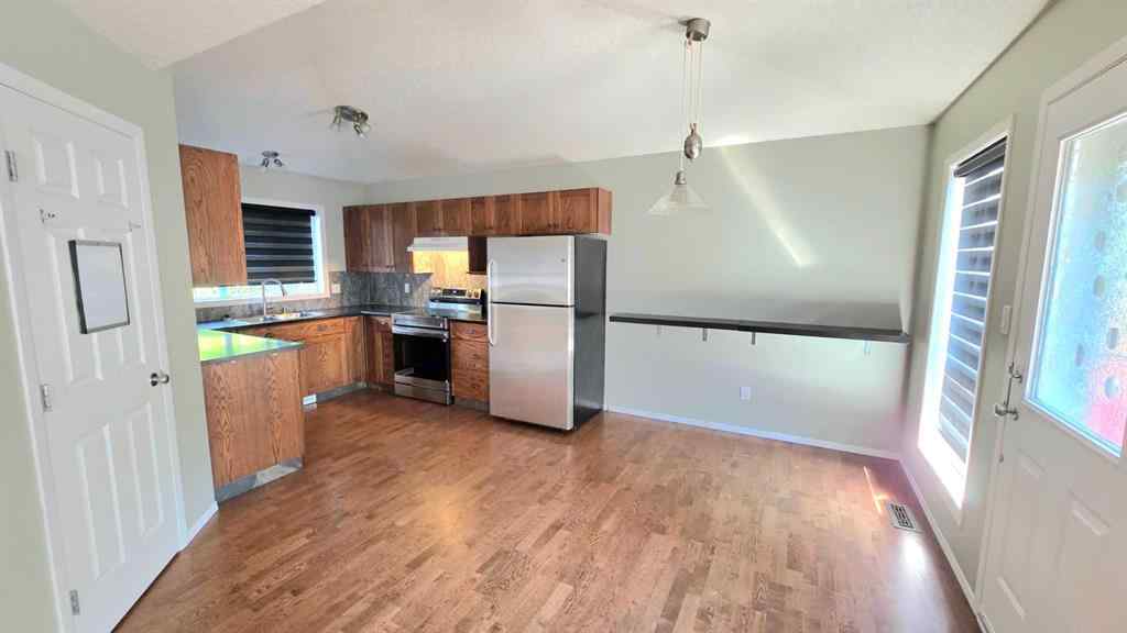 MLS® A2244966 - 9857 66 Avenue  in Country Club West Grande Prairie, Residential