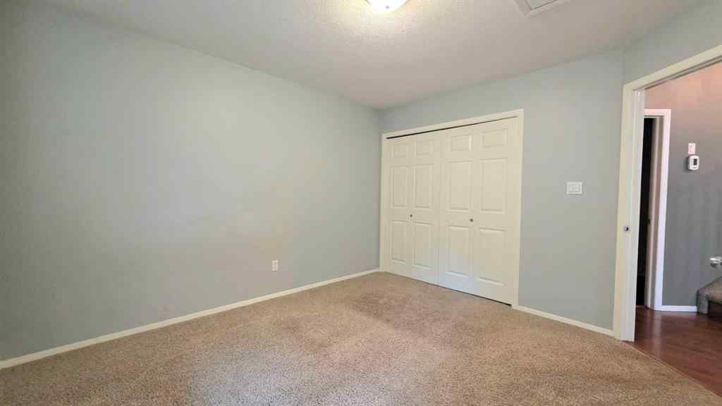 MLS® A2244966 - 9857 66 Avenue  in Country Club West Grande Prairie, Residential