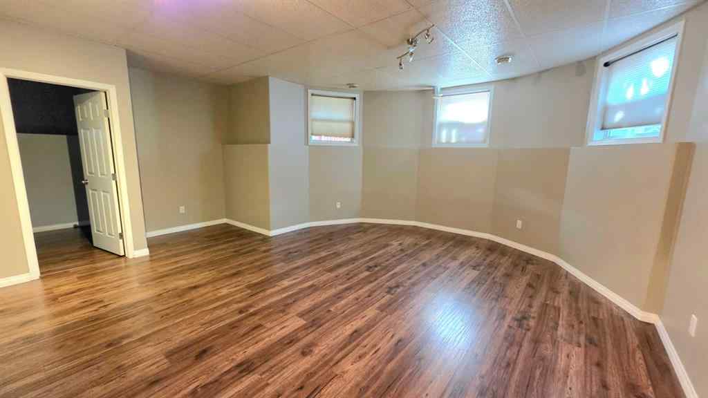 MLS® A2244966 - 9857 66 Avenue  in Country Club West Grande Prairie, Residential