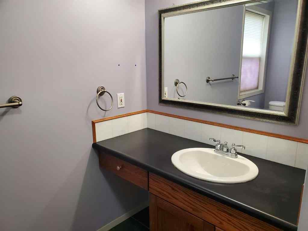 MLS® A2244966 - 9857 66 Avenue  in Country Club West Grande Prairie, Residential