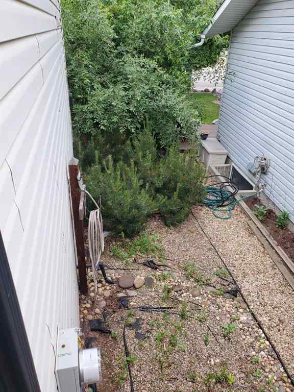 MLS® A2244966 - 9857 66 Avenue  in Country Club West Grande Prairie, Residential