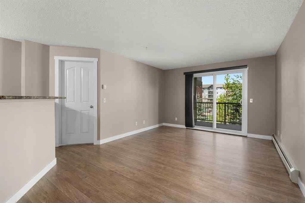 MLS® A2245228 - Unit #8225 304 Mackenzie Way SW in Luxstone Airdrie, Residential