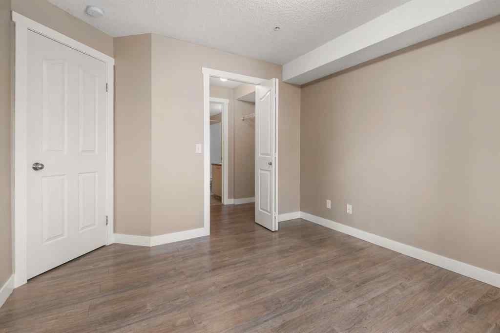MLS® A2245228 - Unit #8225 304 Mackenzie Way SW in Luxstone Airdrie, Residential