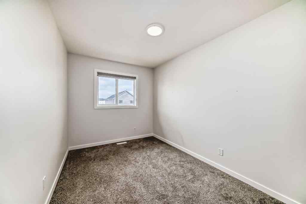 MLS® A2245235 - 21306 Sheriff King Street SW in Pine Creek Calgary, Residential