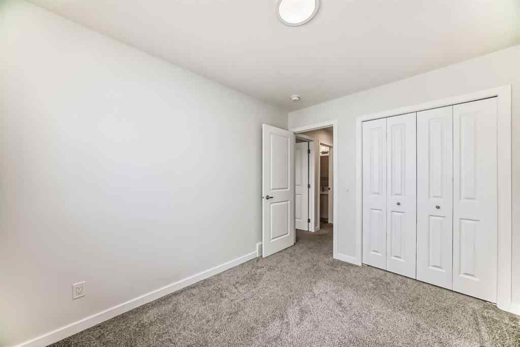 MLS® A2245235 - 21306 Sheriff King Street SW in Pine Creek Calgary, Residential