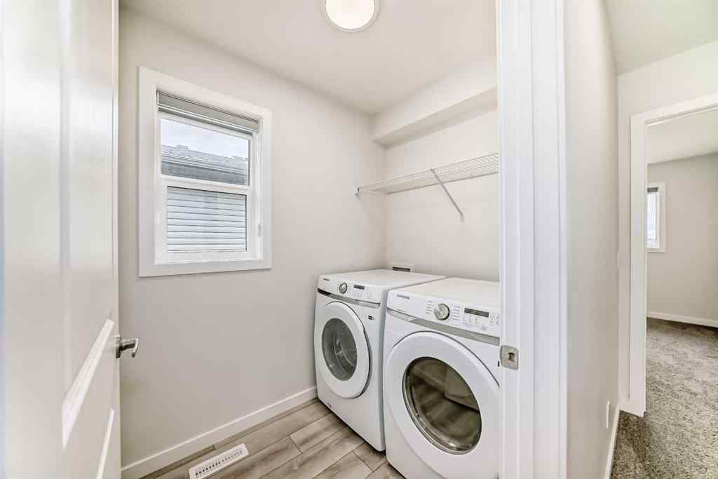 MLS® A2245235 - 21306 Sheriff King Street SW in Pine Creek Calgary, Residential