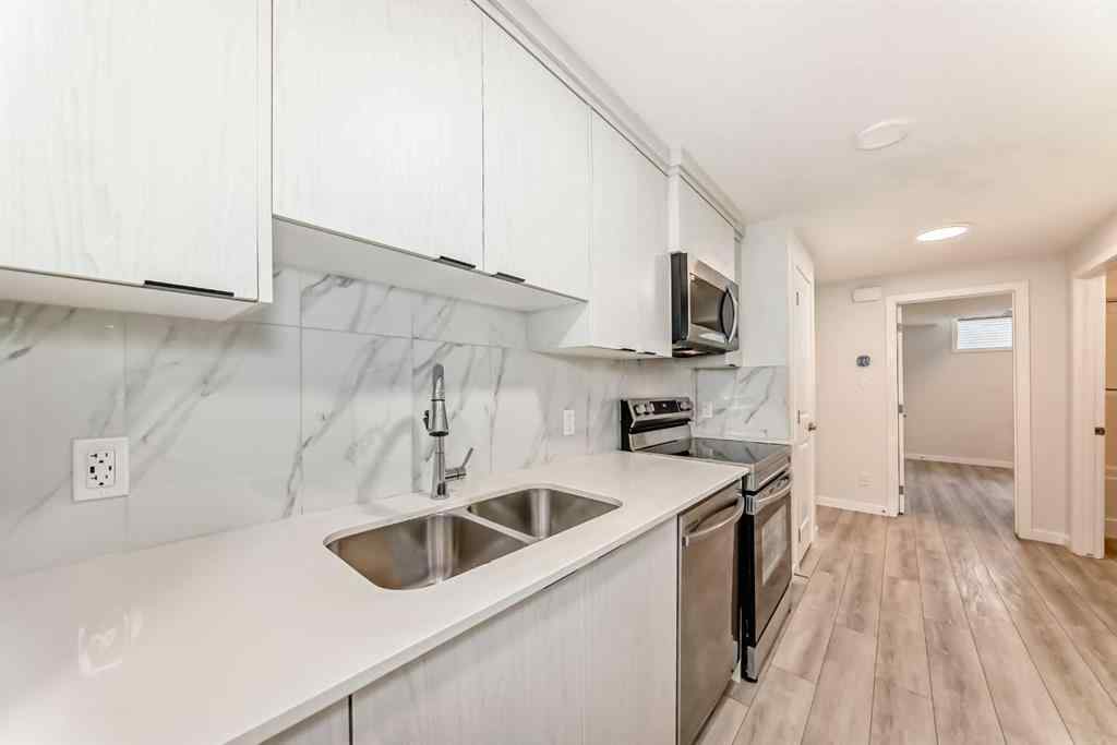 MLS® A2245235 - 21306 Sheriff King Street SW in Pine Creek Calgary, Residential