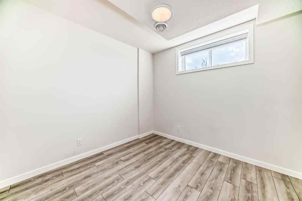 MLS® A2245235 - 21306 Sheriff King Street SW in Pine Creek Calgary, Residential