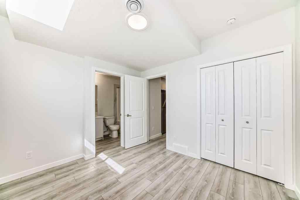 MLS® A2245235 - 21306 Sheriff King Street SW in Pine Creek Calgary, Residential