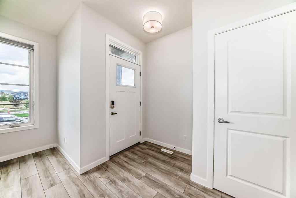 MLS® A2245235 - 21306 Sheriff King Street SW in Pine Creek Calgary, Residential