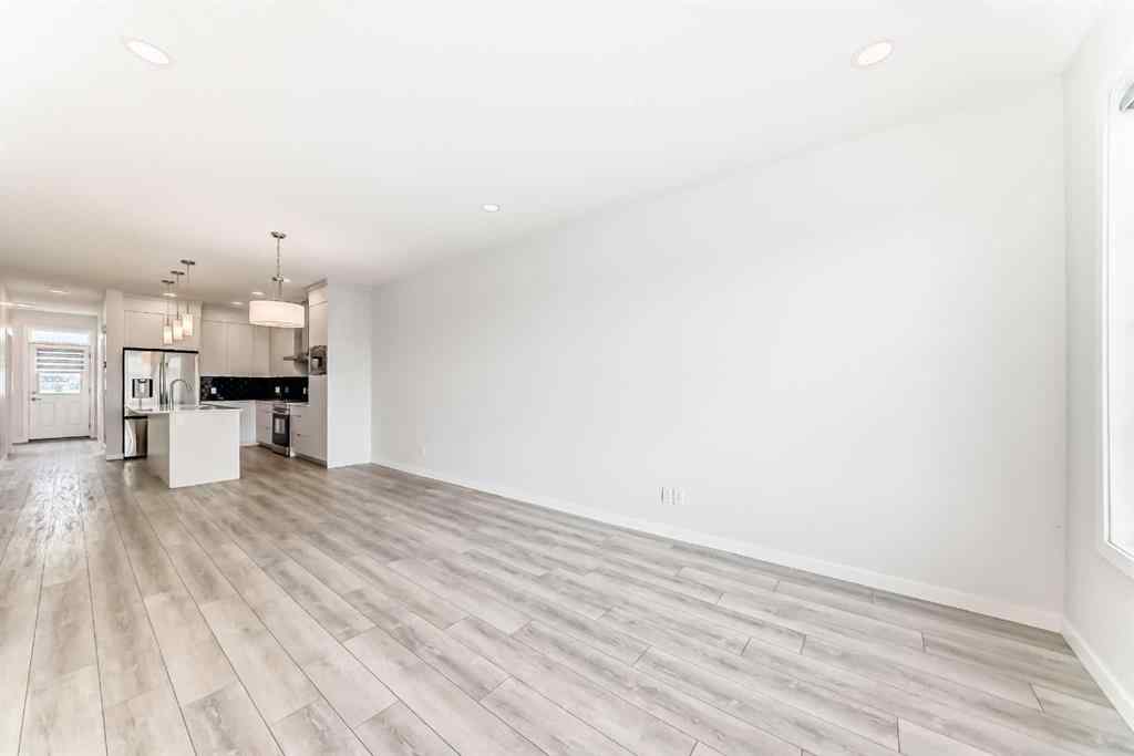 MLS® A2245235 - 21306 Sheriff King Street SW in Pine Creek Calgary, Residential