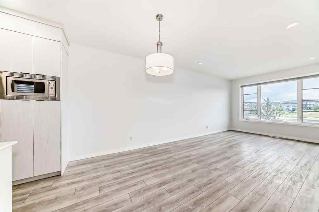 MLS® A2245235 - 21306 Sheriff King Street SW in Pine Creek Calgary, Residential