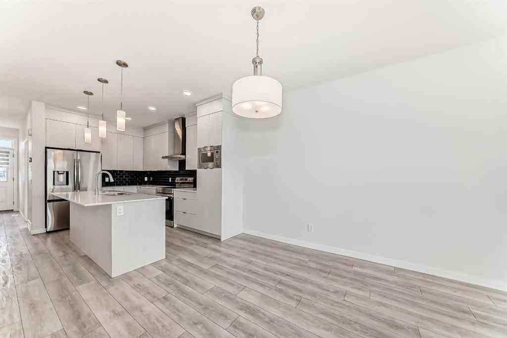 MLS® A2245235 - 21306 Sheriff King Street SW in Pine Creek Calgary, Residential