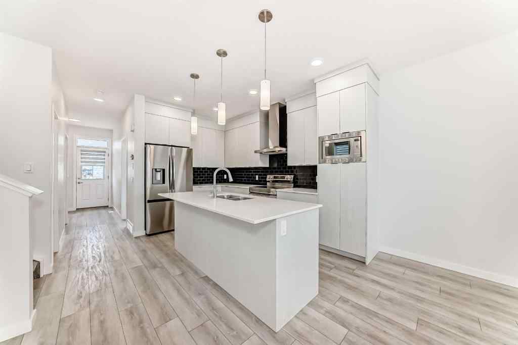 MLS® A2245235 - 21306 Sheriff King Street SW in Pine Creek Calgary, Residential