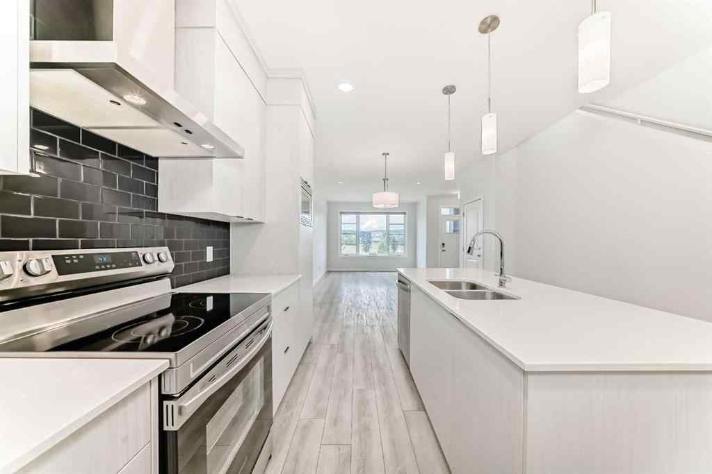 MLS® A2245235 - 21306 Sheriff King Street SW in Pine Creek Calgary, Residential