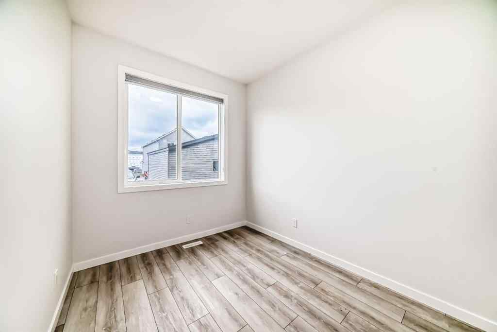 MLS® A2245235 - 21306 Sheriff King Street SW in Pine Creek Calgary, Residential